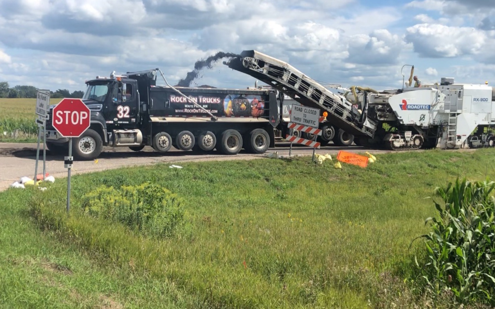 Rock On Trucks quint axle dump truck on a job site